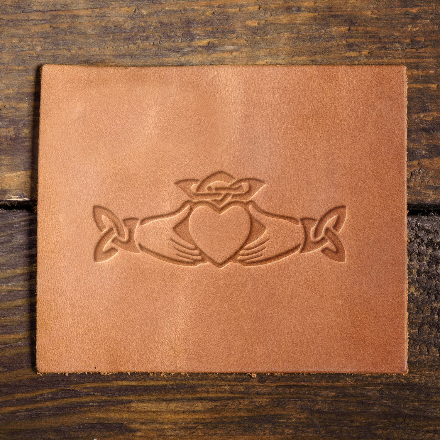 Leather sample with a crisp Claddagh stamp impression, perfect for Celtic-inspired leather designs and meaningful craftsmanship.
