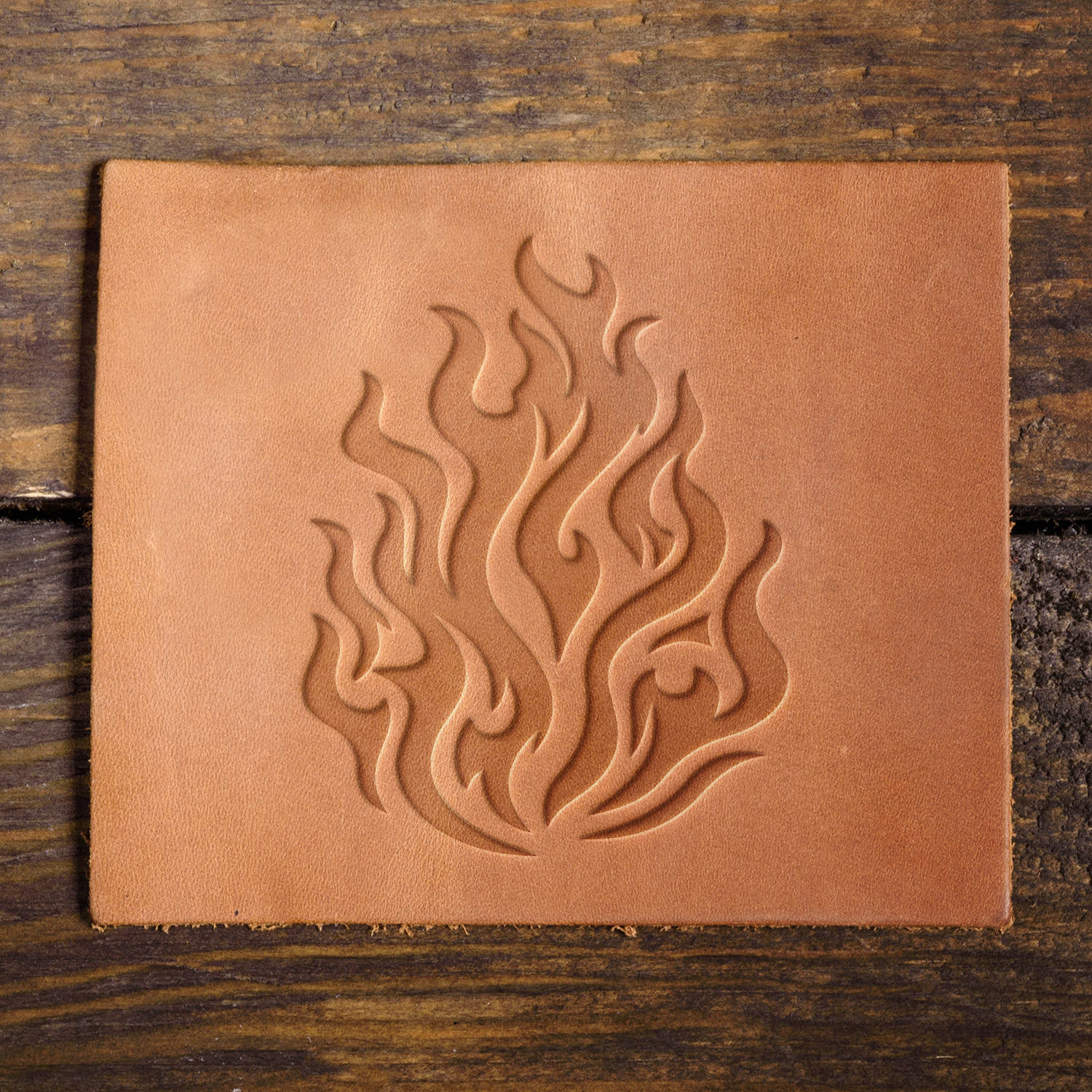 Leather sample with a stamped tribal flame design, adding a bold and dynamic touch to leather projects.