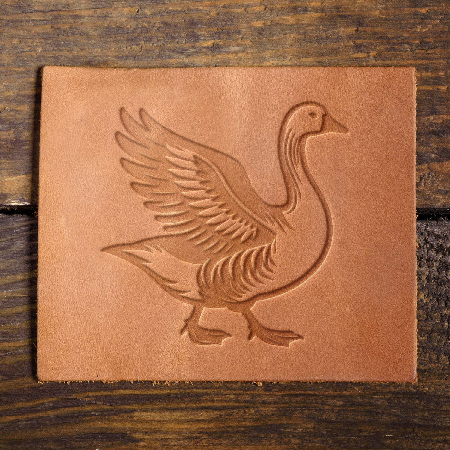 Leather sample with a crisp goose stamp impression, perfect for nature-inspired and farmhouse-style leather projects.