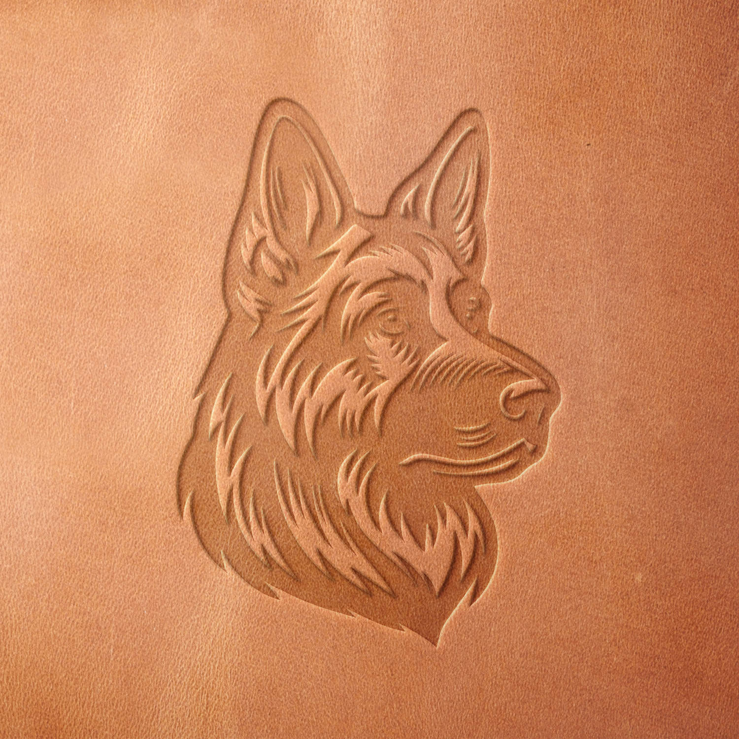 Leather piece stamped with a Delrin leather stamp of a German Shepherd profile—perfect for custom gifts, K9-themed gear, or dog training accessories.