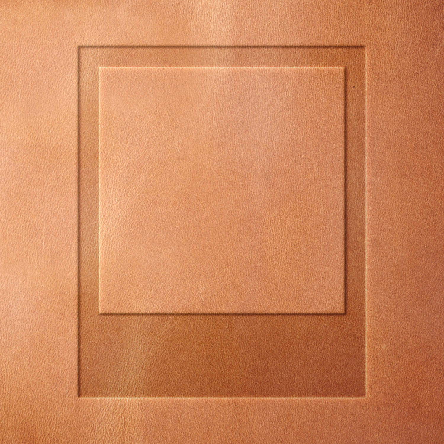 Leather piece stamped with a Delrin leather stamp of a classic Polaroid photo frame—great for photo-themed leather projects or commemorative handmade goods.