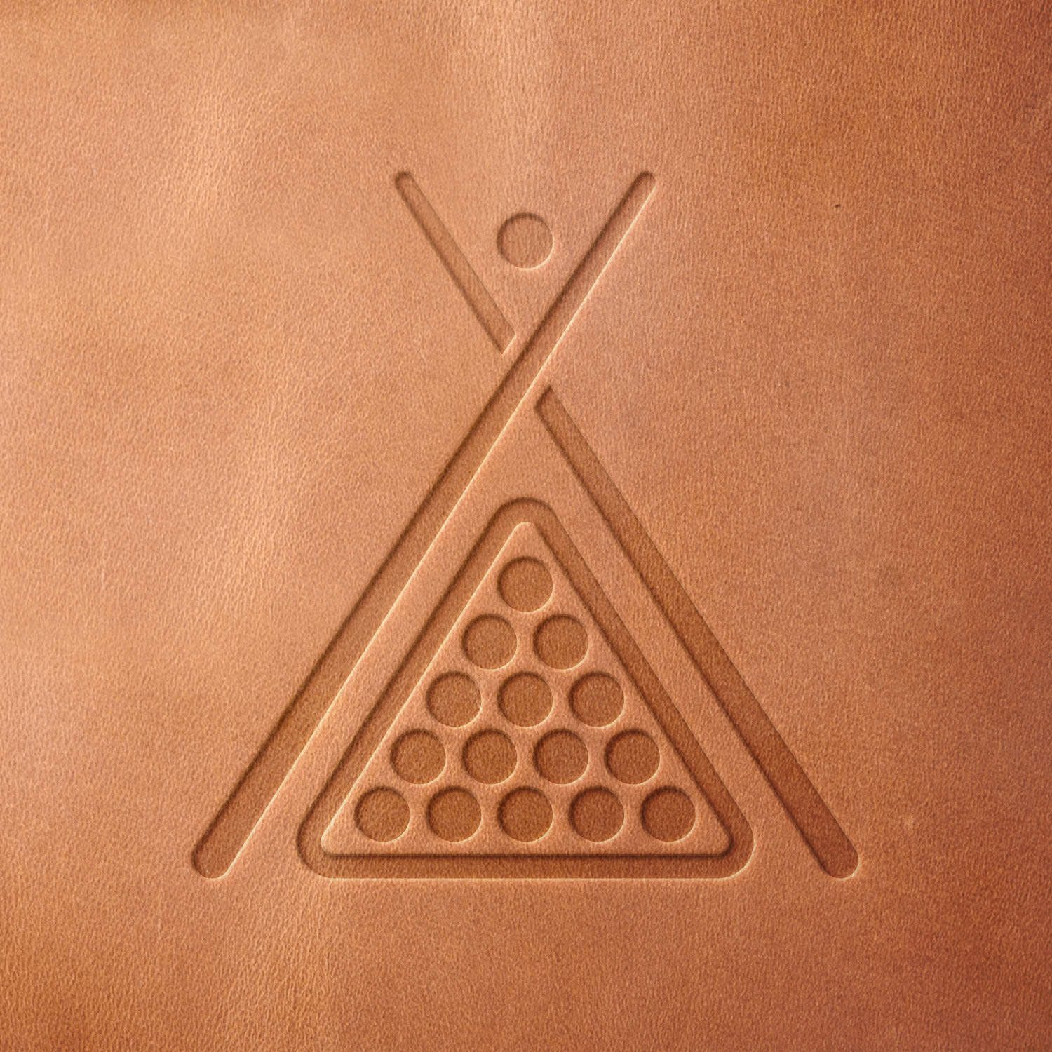 Leather sample with a clean billiards triangle and cue stick stamp impression, adding a stylish touch to pool-themed leather projects.