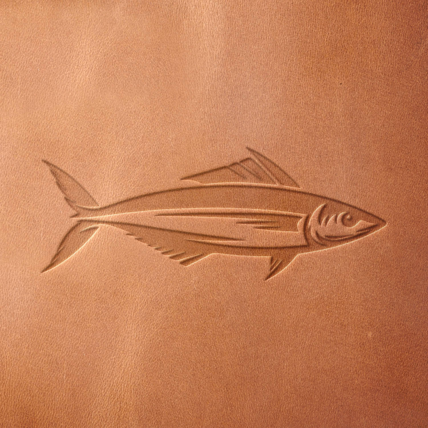 Leather sample with a crisp tuna fish stamp impression from a Delrin leather stamp, ideal for creating high-quality fishing and marine-themed leathercraft projects.