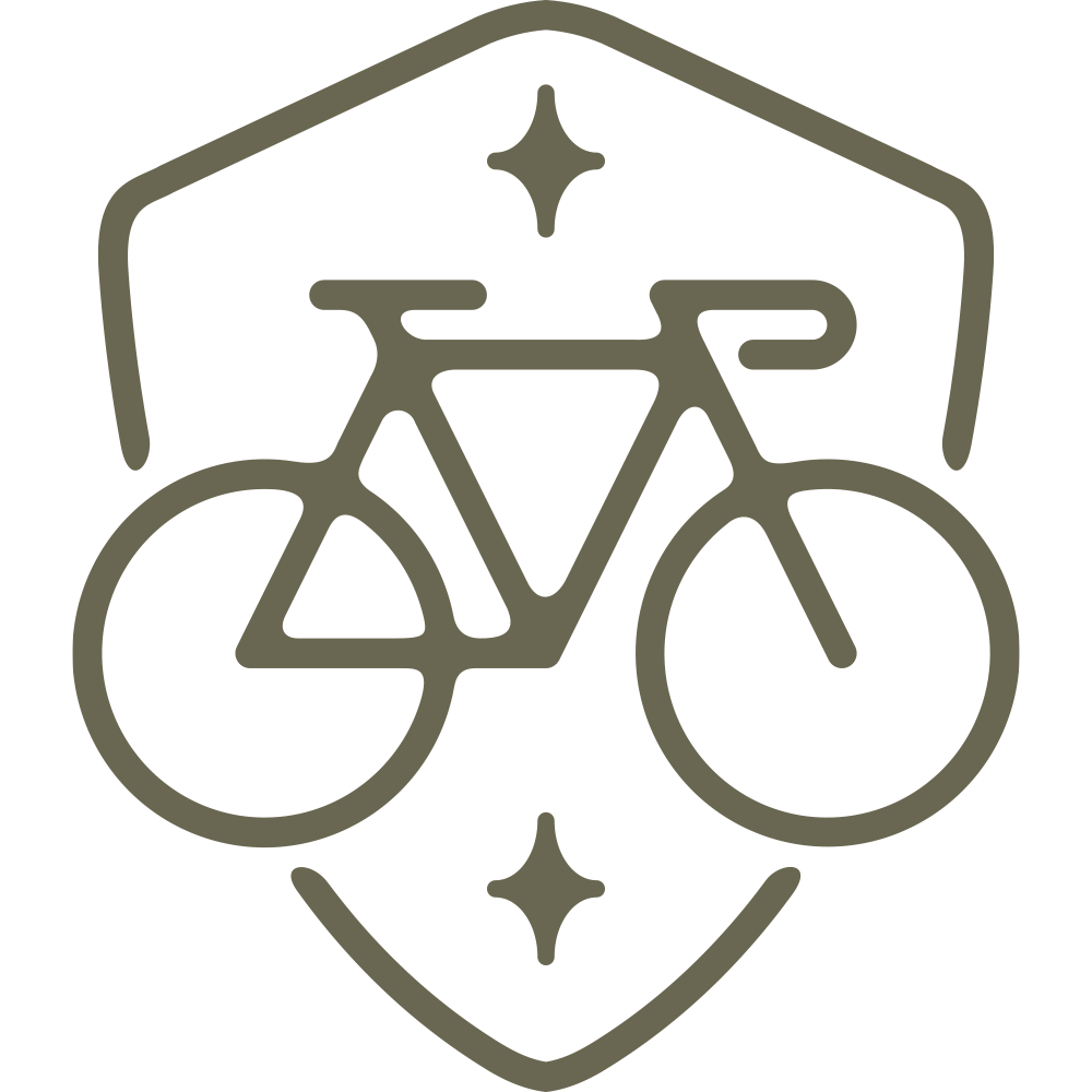 Modern bicycle emblem design featuring a sleek road bike within a shield frame, accented with decorative star details.