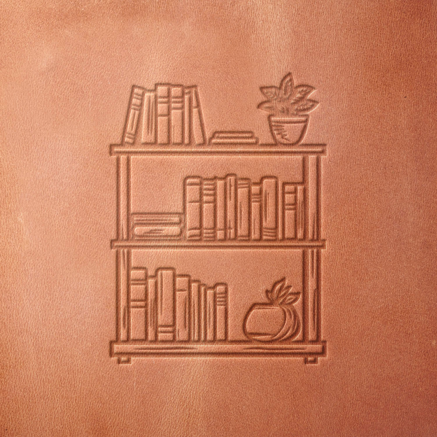 Leather sample featuring a stamped bookshelf design, created using a Delrin leather stamp—ideal for book lovers, writers, and custom leather engravings.