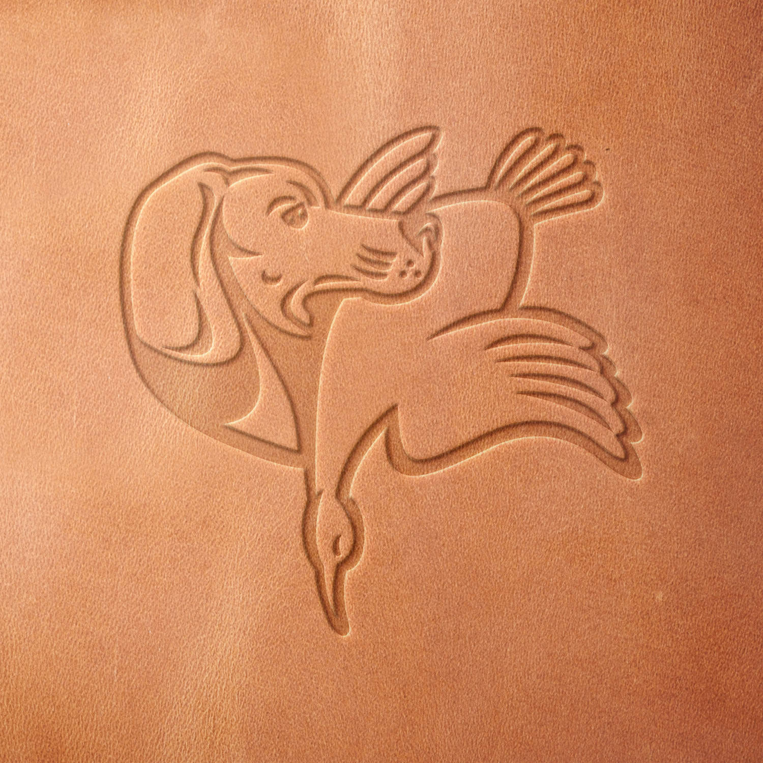 Leather sample with a stamped hunting dog and waterfowl design, created using a Delrin leather stamp—perfect for hunters, retriever enthusiasts, and sporting gear customization.