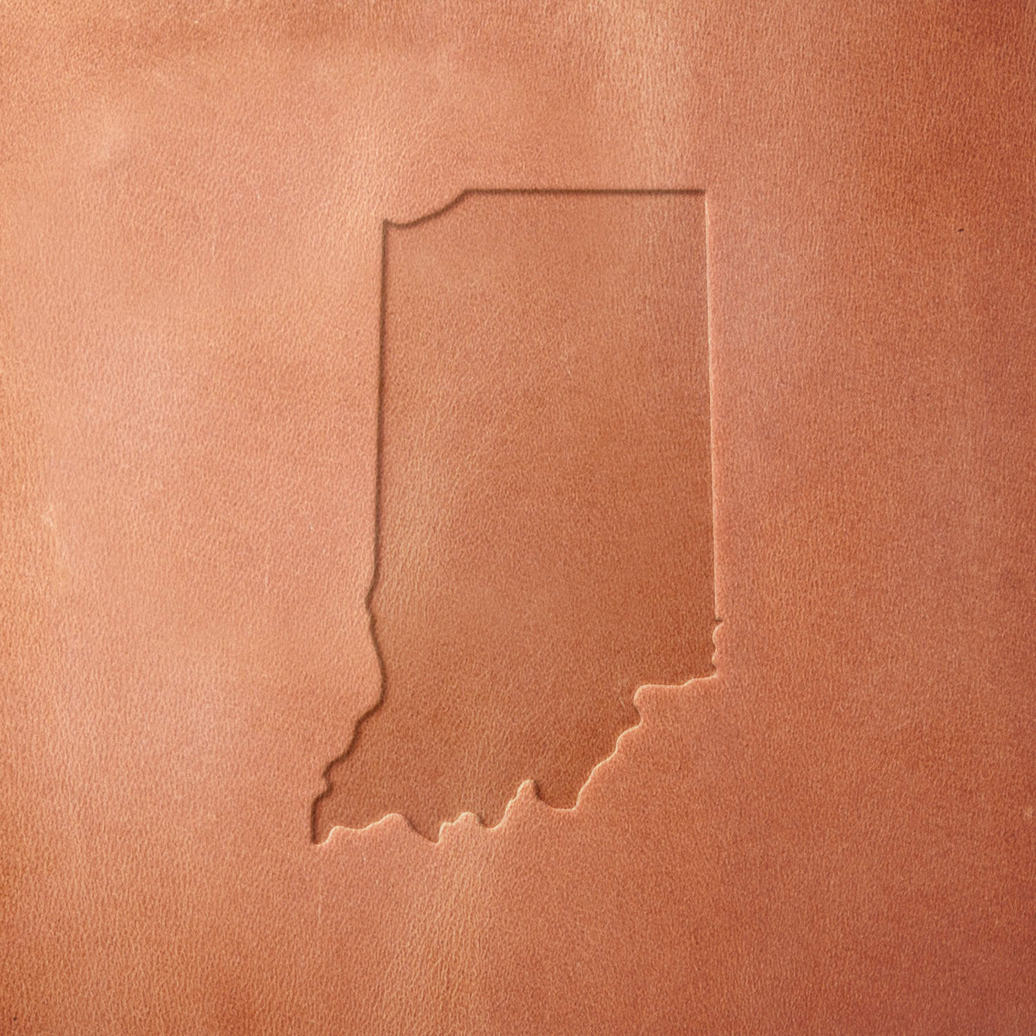 Leather sample featuring a stamped Indiana state outline, crafted using a Delrin leather stamp—perfect for custom leather goods, Midwest-themed designs, and handcrafted keepsakes.
