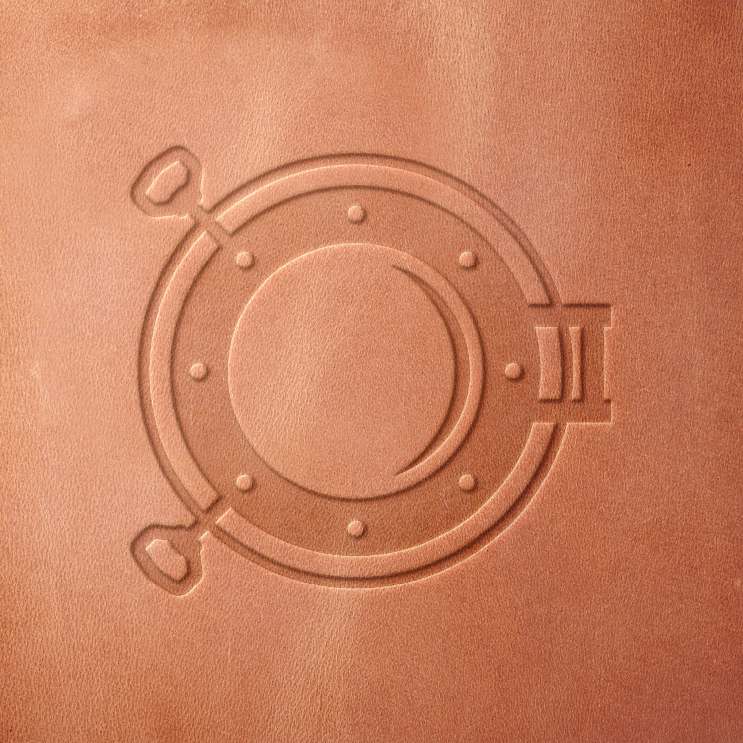 Leather sample featuring a stamped nautical porthole, created using a Delrin leather stamp—ideal for maritime, sailing, and ocean-themed projects.