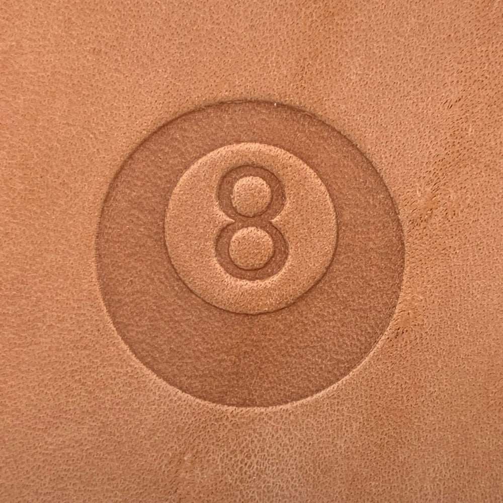 Leather product featuring a pool billiards 8-ball design stamped with a Delrin tool, perfect for creating billiards and game-themed leather crafts