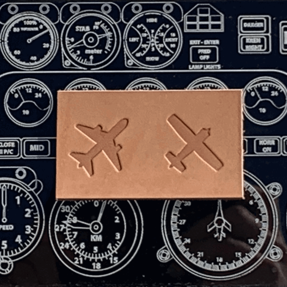 Leather piece with airplane silhouette imprint, crafted using a Delrin stamp, perfect for travel enthusiasts