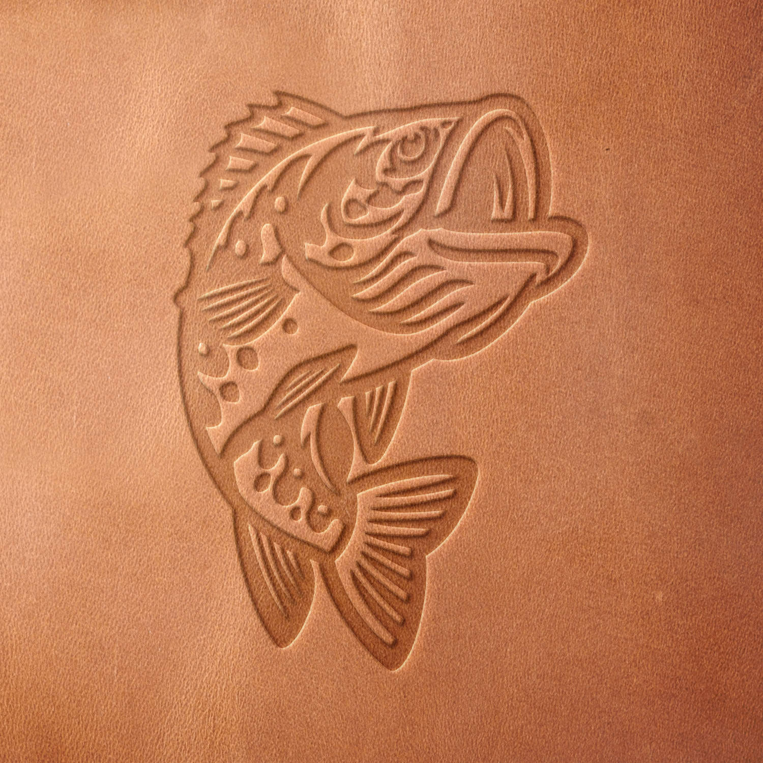 Leather sample with a crisp jumping bass stamp impression from a Delrin leather stamp, ideal for creating high-quality fishing-themed leathercraft projects.