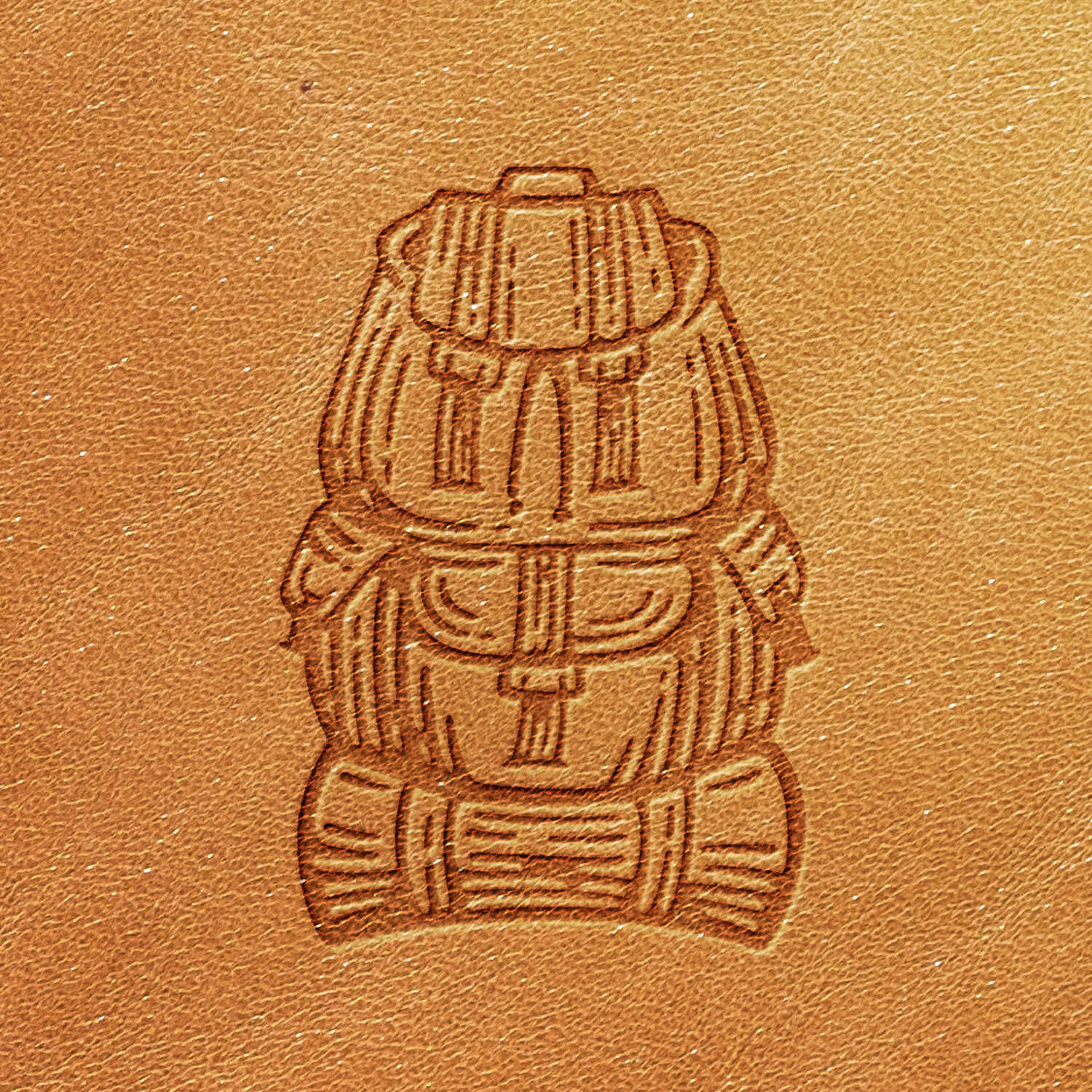 Product Name: Backpack Delrin Leather Stamp

Sentence: The Backpack Delrin Leather Stamp features an intricate leather imprint showcasing two highly detailed backpacks stacked on top of each other. This design is meticulously embossed on a light brown leather surface, accentuating the textural contrasts between the embossed and flat areas.