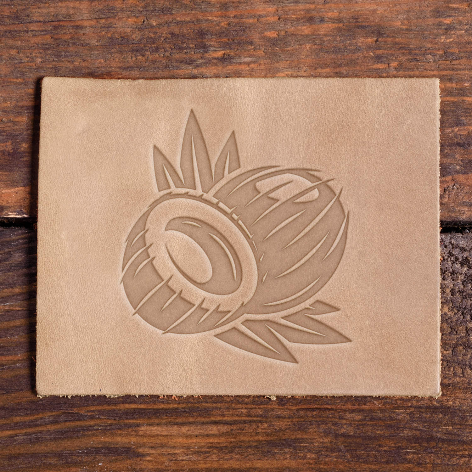 Coconut image stamped into a leather swatch, made using a Delrin leather stamp