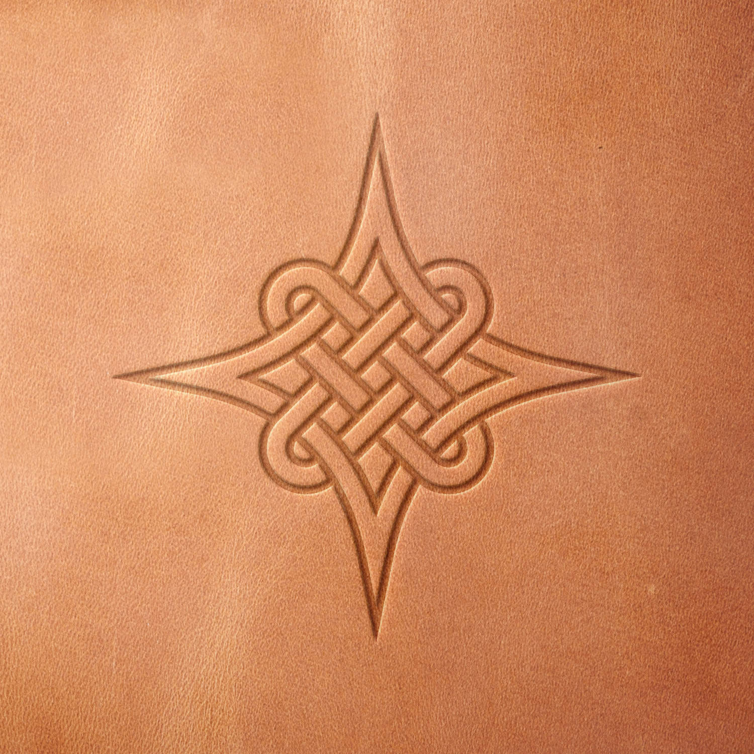 Leather sample stamped with a Delrin leather stamp, showcasing a Celtic knot with a woven center and pointed star-like accents.