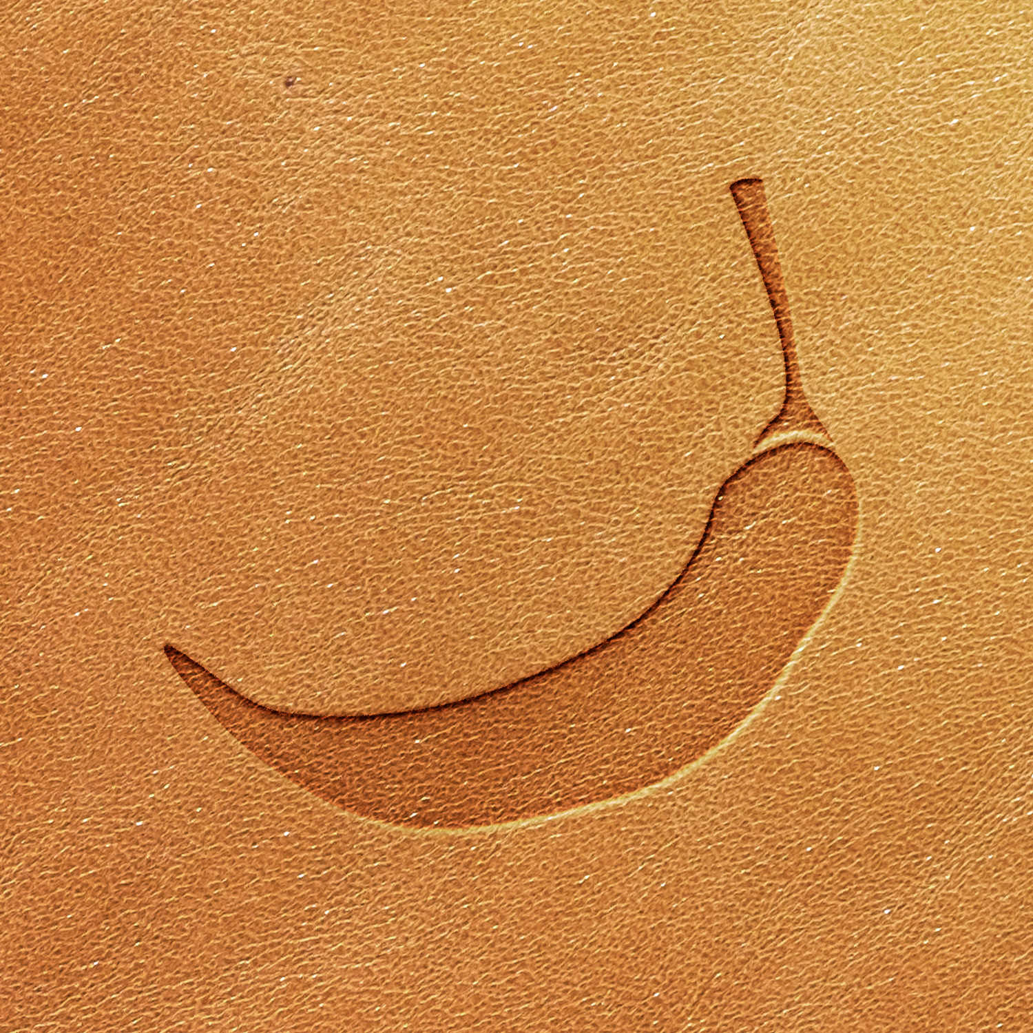 Carved into a light brown textured surface is a simple linear depiction of a chili pepper with a small stem at its top end. The chili pepper outline appears slightly embossed against the background.