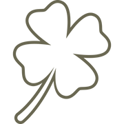 Minimalist four-leaf clover design featuring smooth, rounded edges and a simple stem.