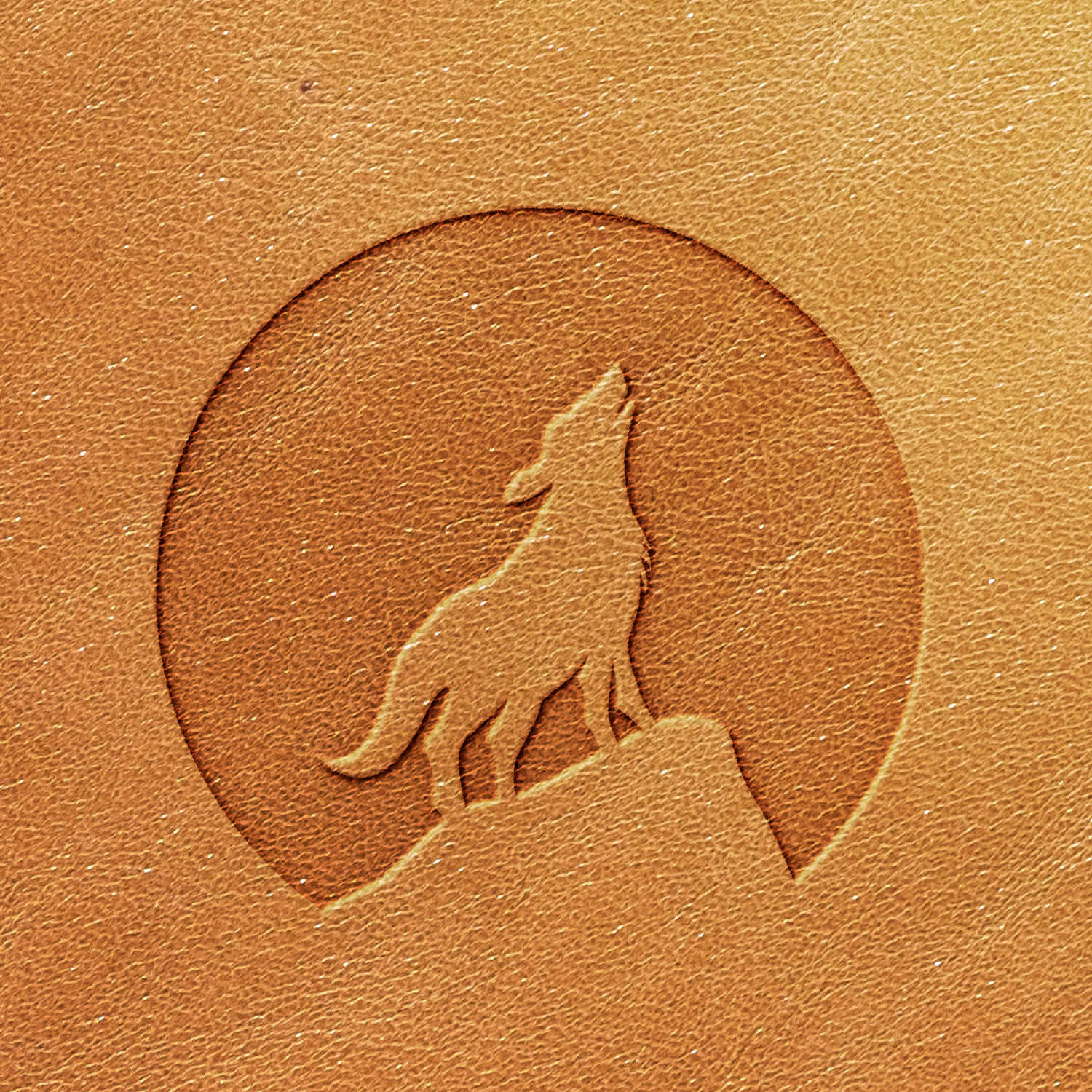 The Coyote Delrin Leather Stamp features a textured leather surface with an embossed design of a coyote howling on a rock against a circular background. The image appears in light brown, with the embossed coyote and circle adding subtle depth to the surface.