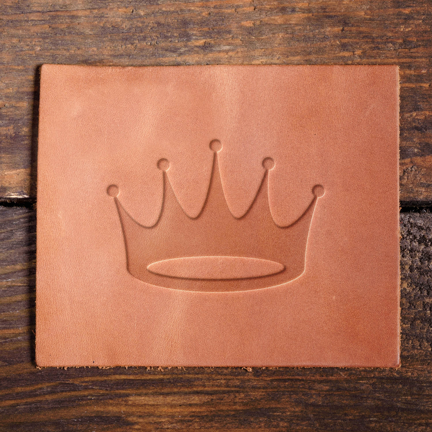 Leather sample with a crisp crown stamp impression from a Delrin leather stamp, ideal for creating high-quality royal and luxury-themed leathercraft projects.