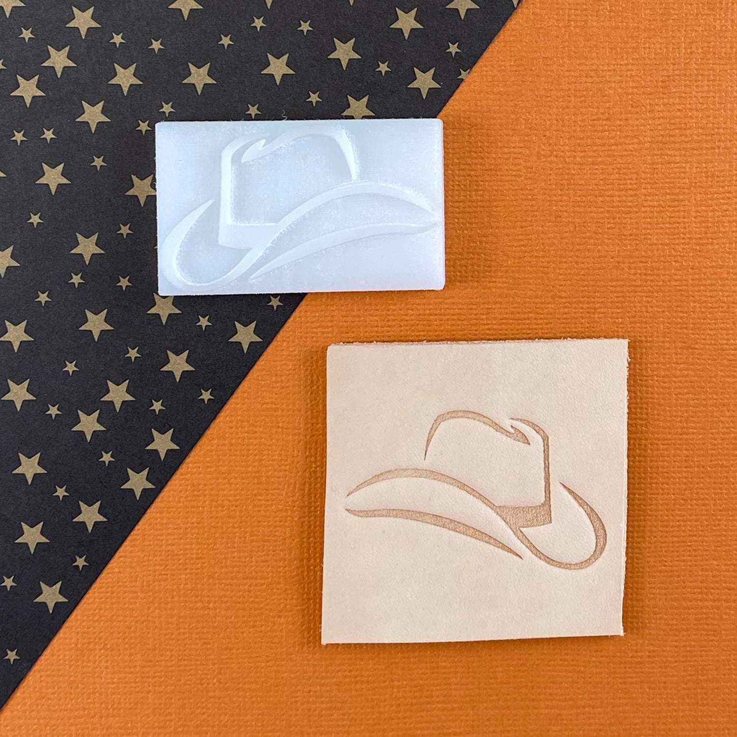 Veg-tan leather swatch and Delrin leather stamp with a cowboy hat design.