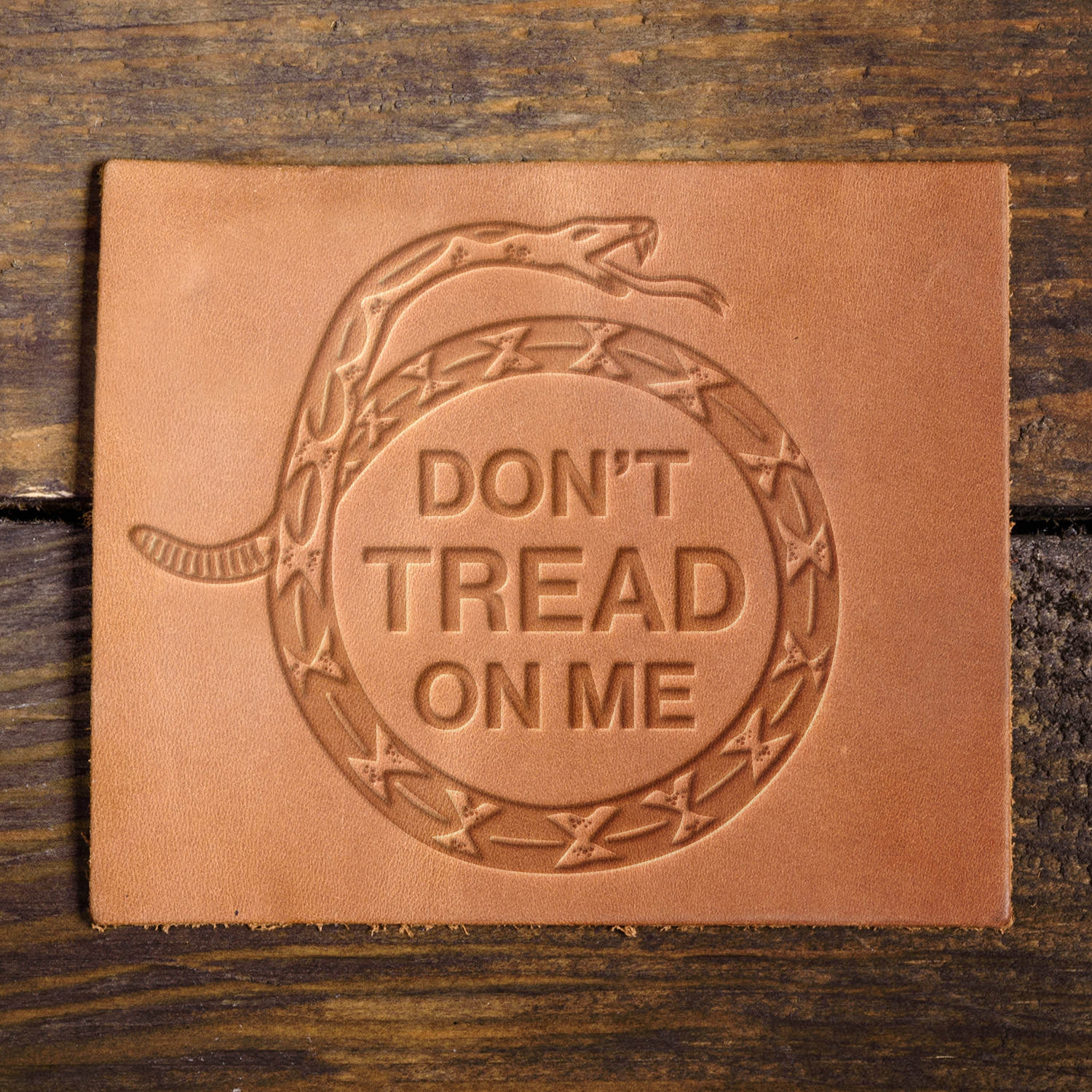 Leather sample with a crisp “Don’t Tread on Me” stamp impression, perfect for patriotic and historical-themed leathercraft.