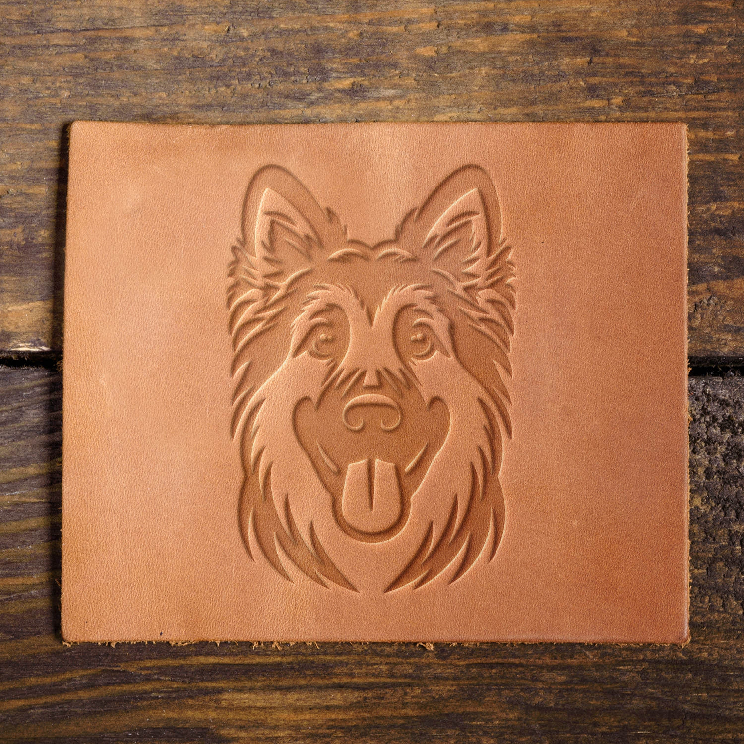 Leather sample showcasing a German Shepherd dog design, stamped with a Delrin leather stamp, highlighting the breed’s intelligence and protective nature.