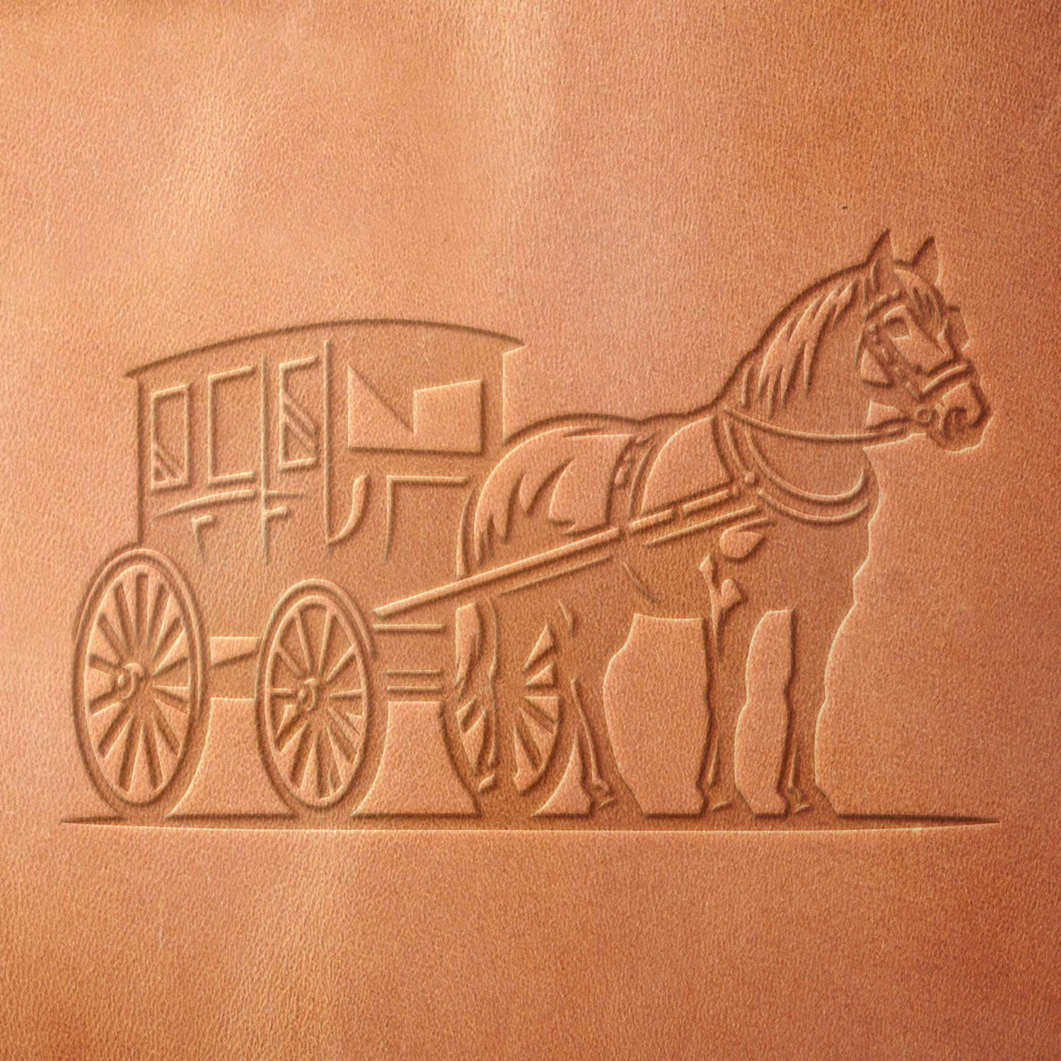 Leather sample showcasing a stamped horse-drawn carriage design using a delrin leather stamp, emphasizing the intricate harness details, spoked wheels, and vintage aesthetic.