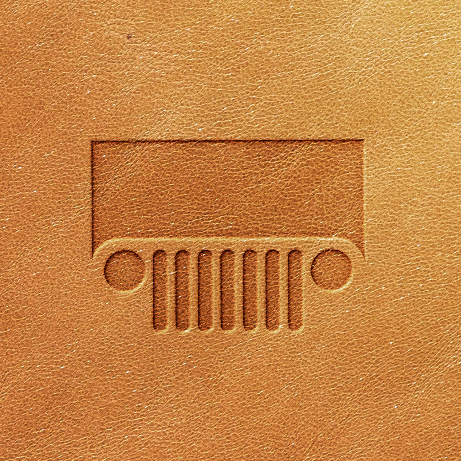 The Jeep Grille Delrin Leather Stamp creates a minimalist depiction of the iconic front view of a Jeep grill on a textured brown leather surface, showcasing its distinctive seven vertical slats flanked by two circular headlights within a rectangular shape.