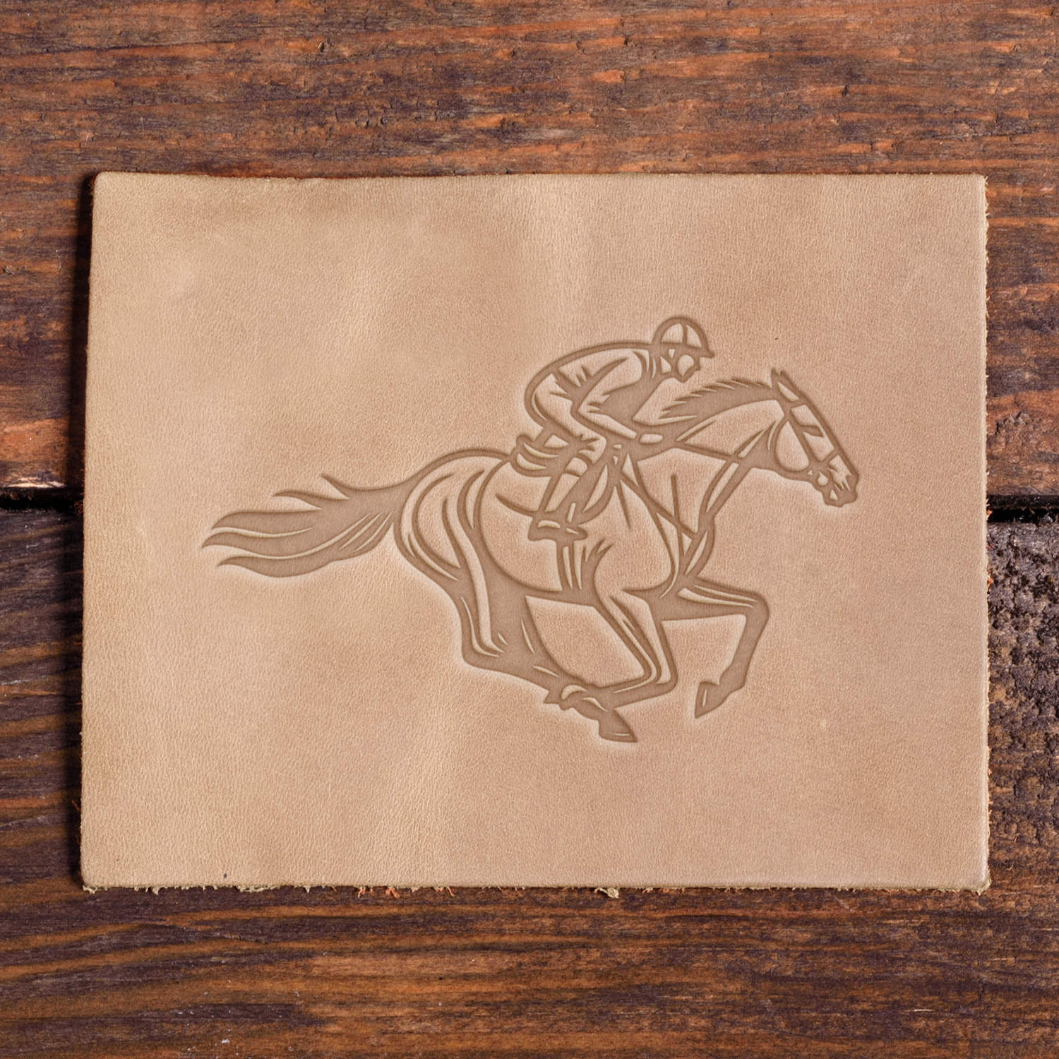 Leather patch stamped with Delrin horse and jockey stamp in mid-race pose.