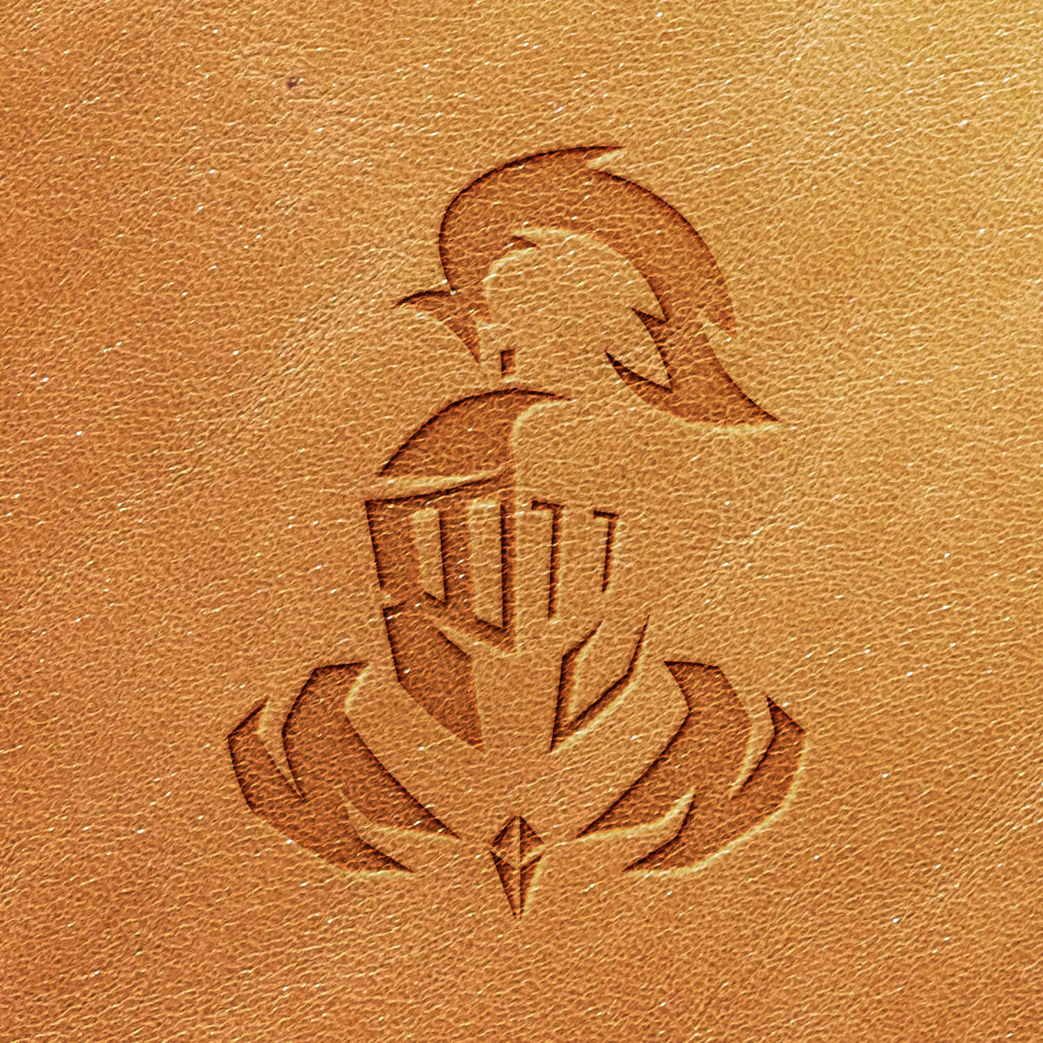 The Knight Delrin Leather Stamp creates a stylized image of a knight in armor, complete with helmet and plume, on a tan leather surface. The design is simple and symmetrical, featuring clean lines that stand out against the leather's texture.