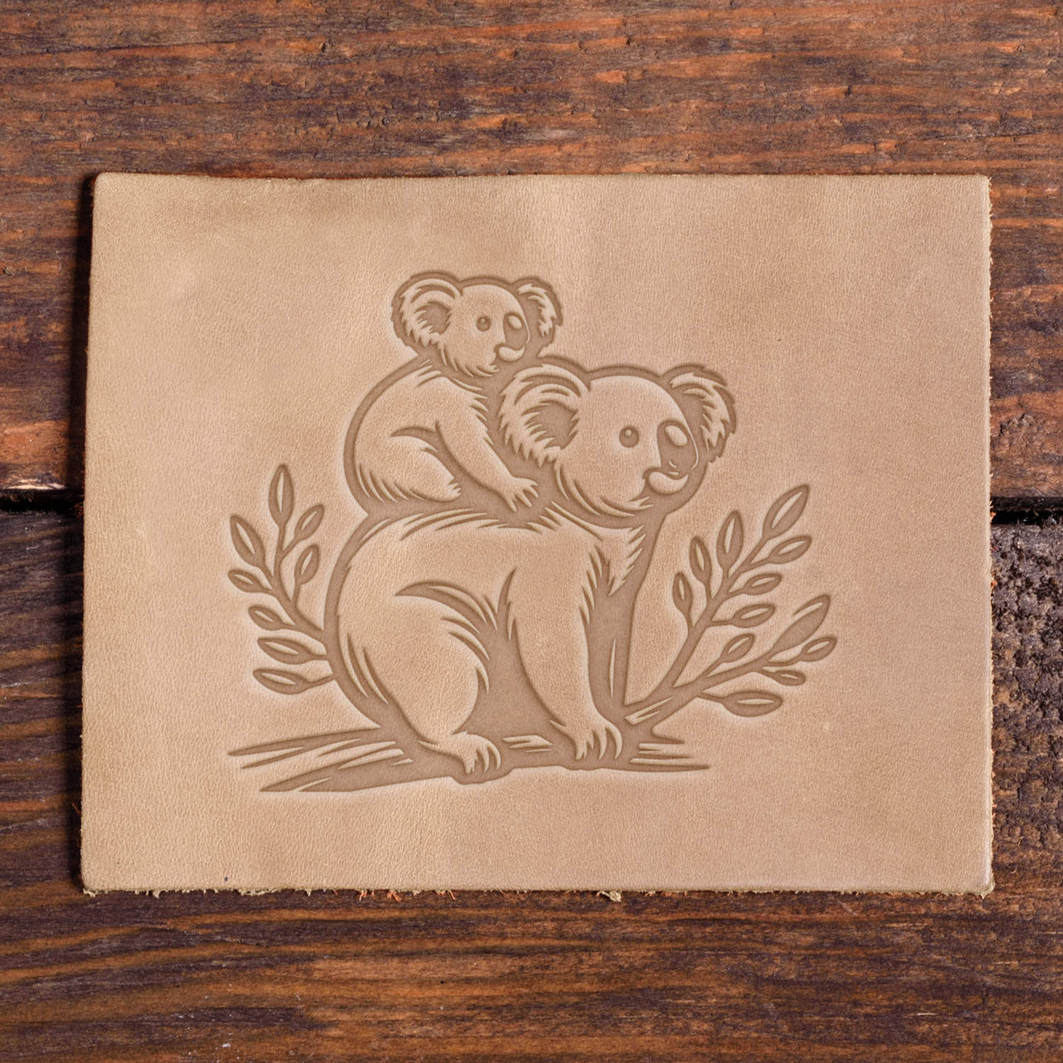 Koala with baby stamped into leather using a Delrin leather stamp.