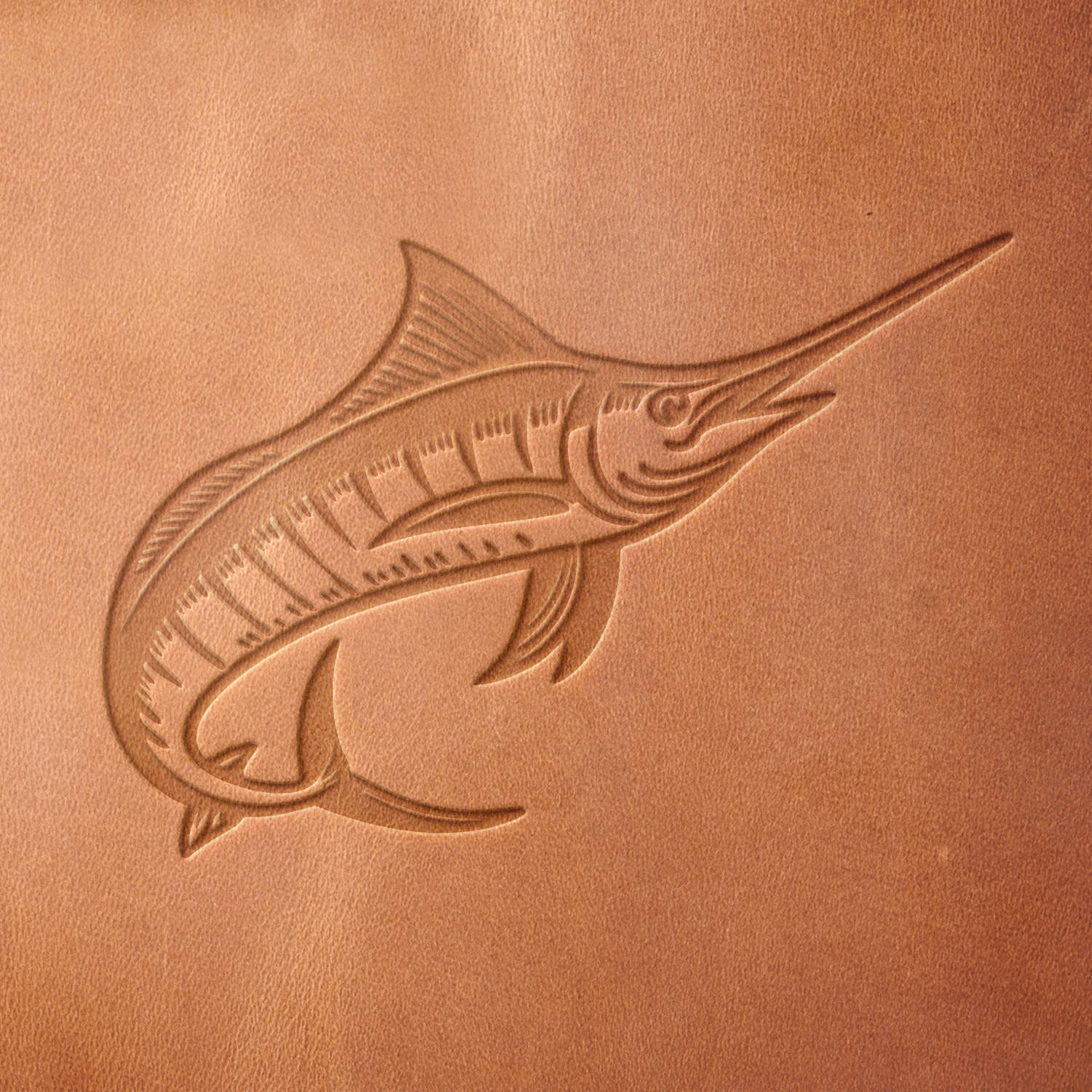 Leather sample with a crisp swordfish stamp impression from a Delrin leather stamp, ideal for creating high-quality fishing and ocean-themed leathercraft projects.