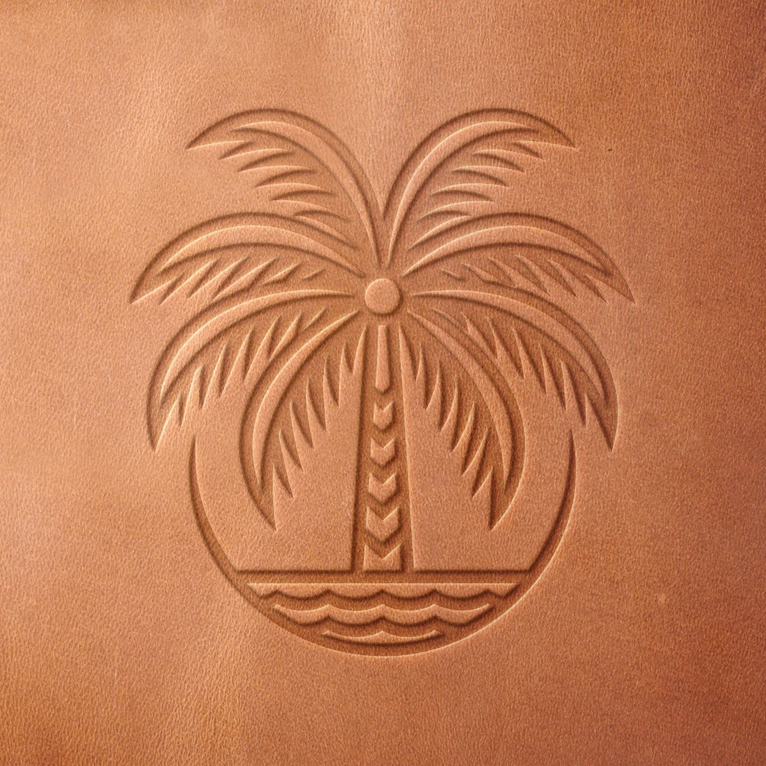 Leather sample with a crisp palm tree and ocean stamp impression from a Delrin leather stamp, ideal for creating high-quality tropical and beach-themed leathercraft projects.