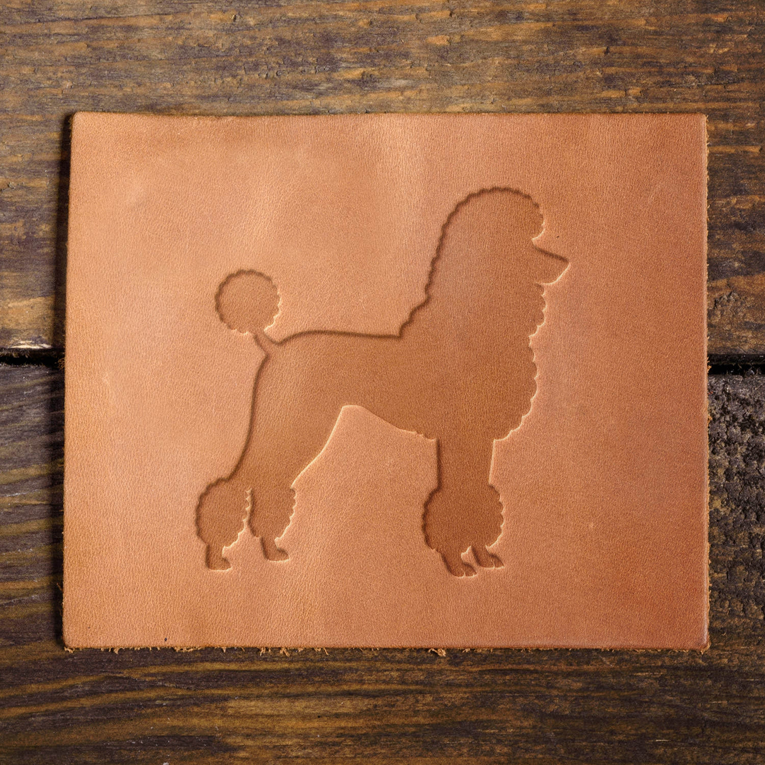 Leather sample with a crisp poodle stamp impression, perfect for pet lovers and dog-themed leathercraft projects.