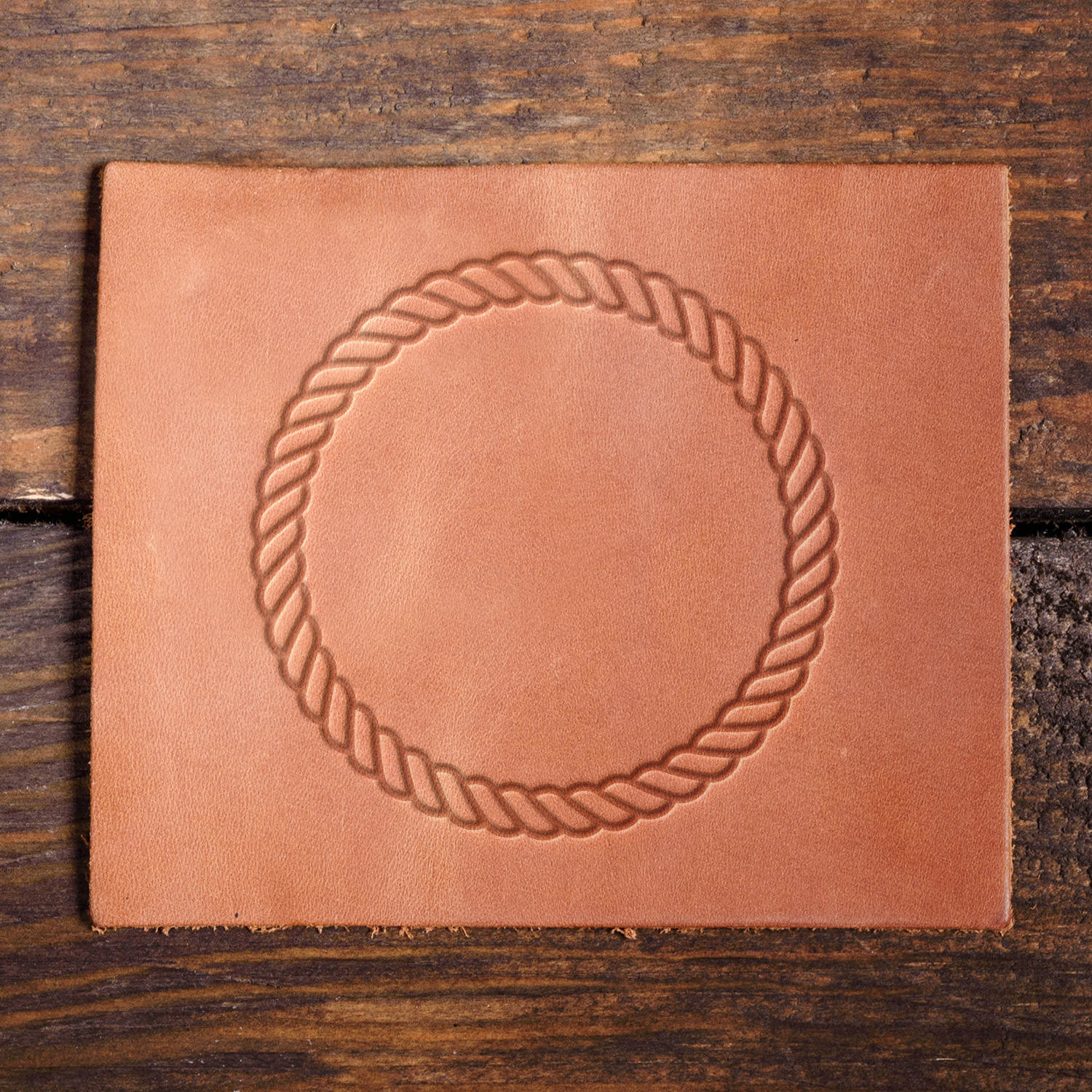 Leather sample with a crisp twisted rope circle stamp impression from a Delrin leather stamp, ideal for creating high-quality western and nautical-themed leathercraft projects.