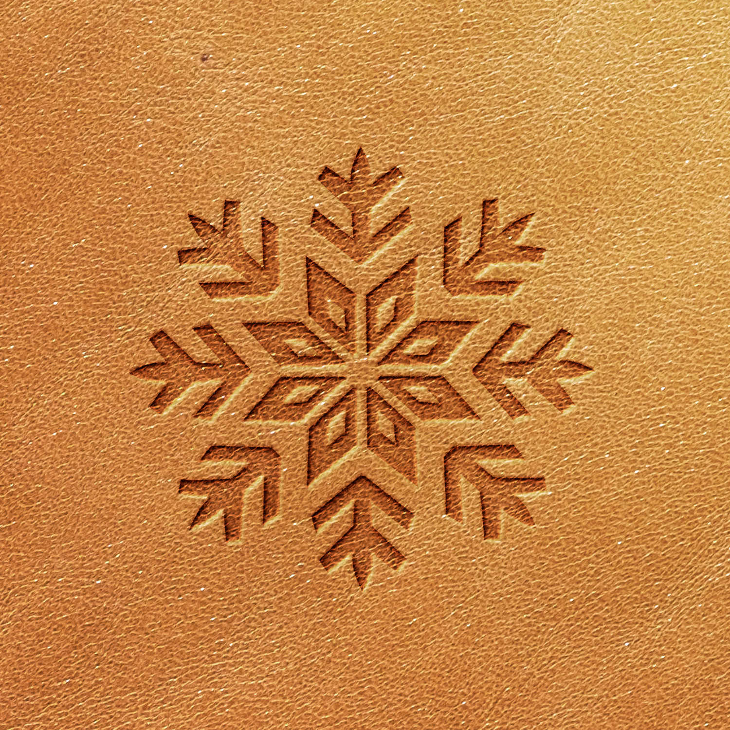 The Snowflake Delrin Leather Stamp creates a detailed snowflake pattern on a brown, leather-like textured surface, evoking a sense of elegance.