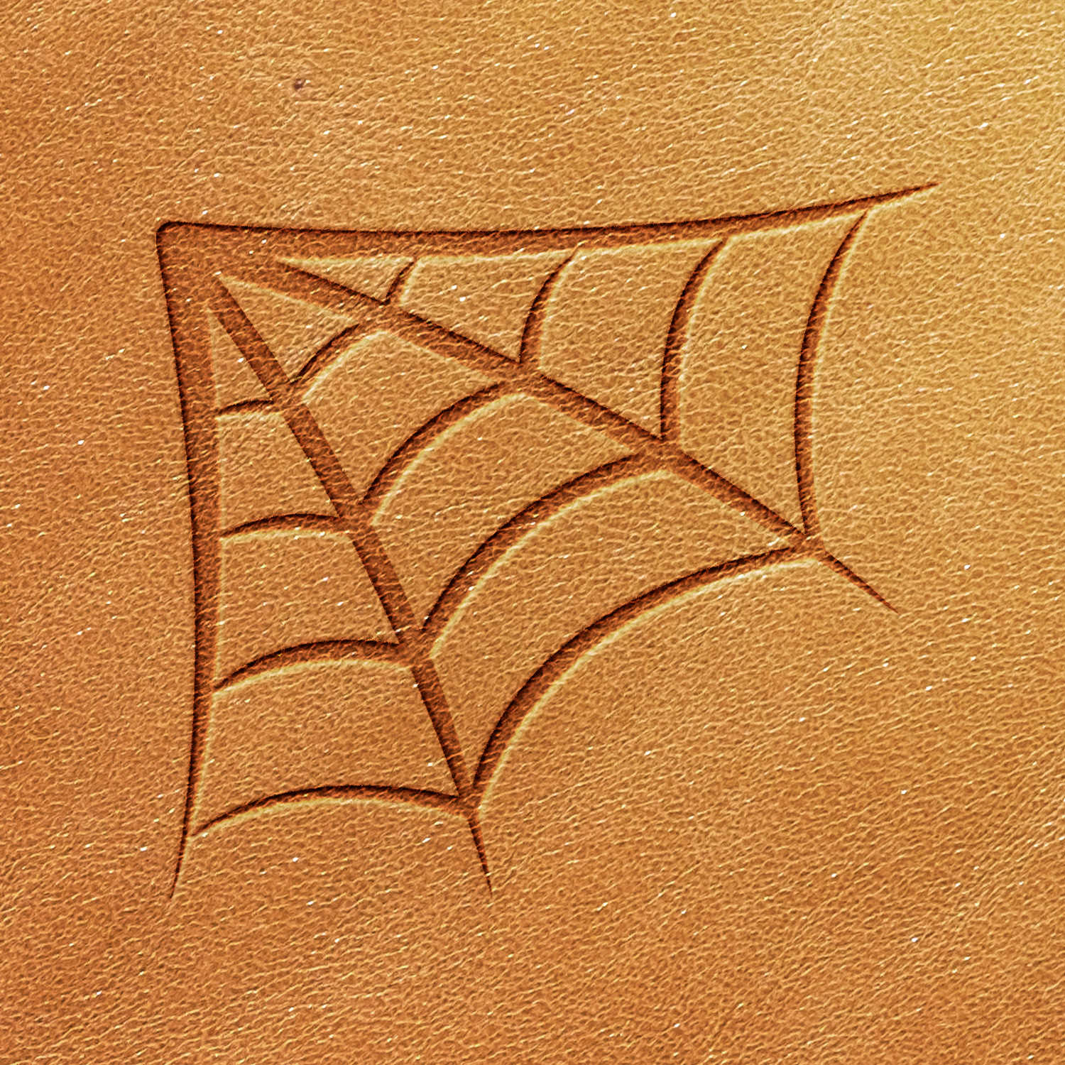 The Spiderweb Delrin Leather Stamp embosses a spider web pattern onto a light brown leather surface, featuring multiple intersecting lines that form a stylized web within a square shape. The texture of the leather remains visible.