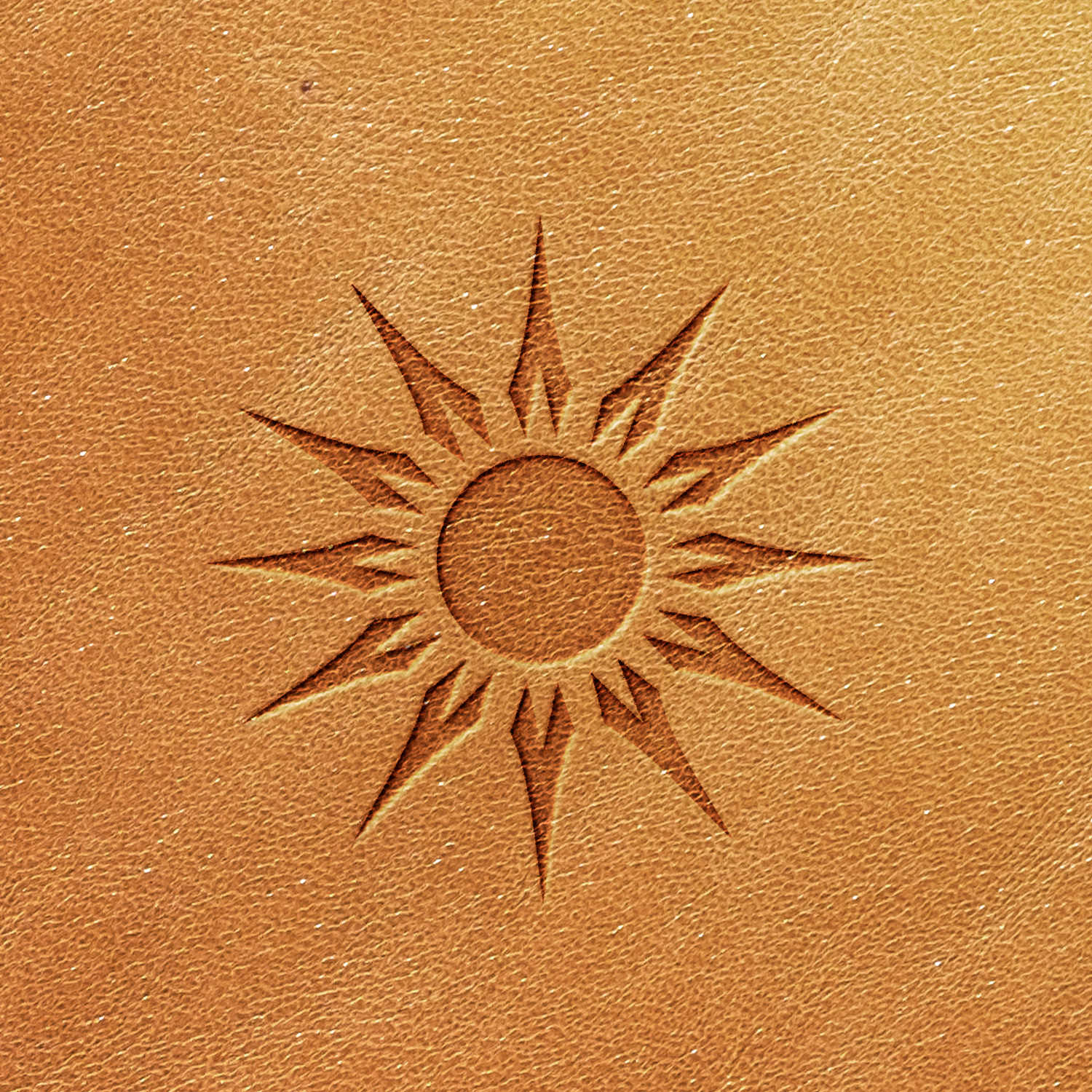 The Sun Delrin Leather Stamp features an embossed design of a sun symbol with multiple pointed rays, arranged in a stylized, geometric pattern on a light brown leather-like surface.