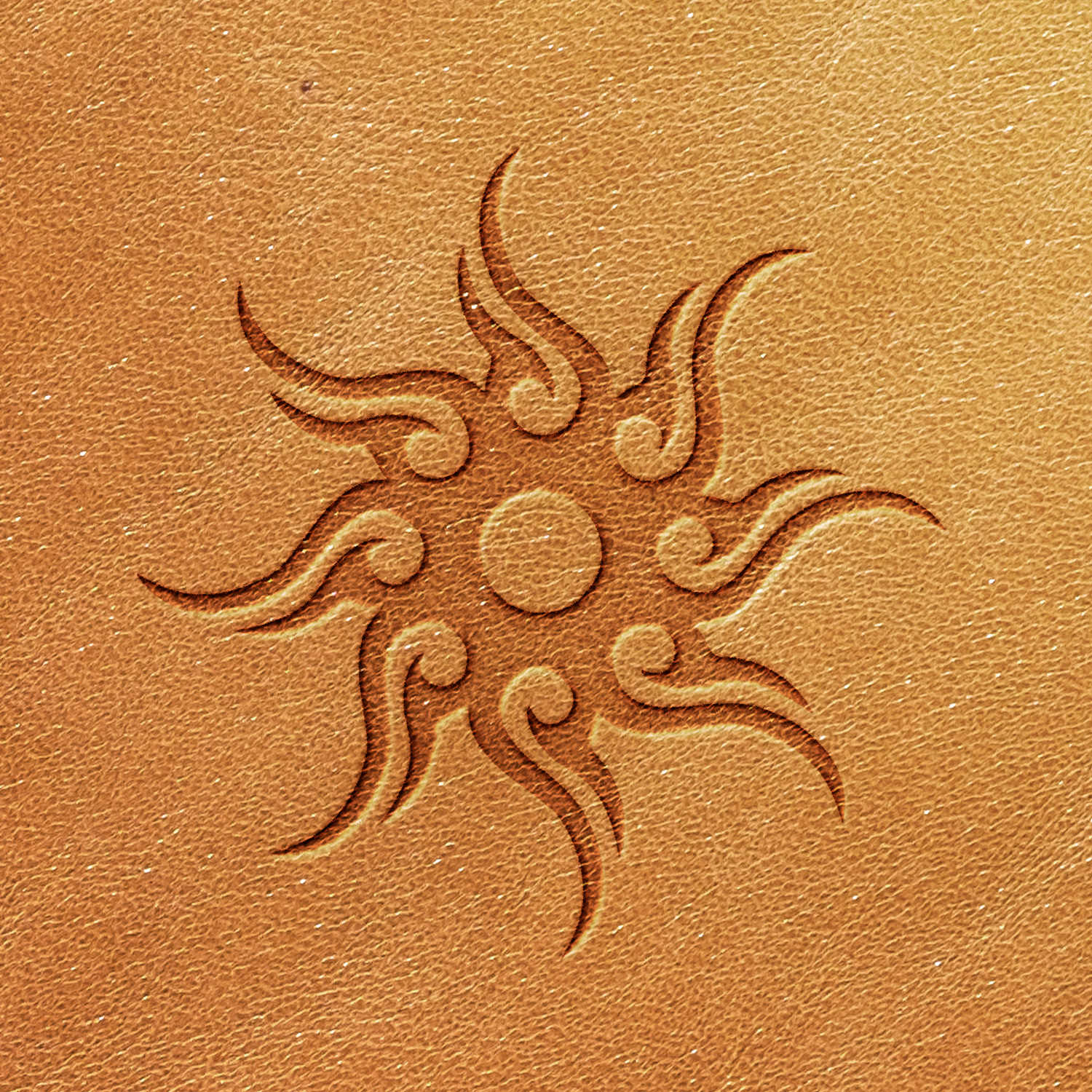 The Sunburst Delrin Leather Stamp embosses a sun symbol with spiraling rays onto a textured, golden-brown leather surface, creating a dynamic and ornamental design that radiates from a central circle.