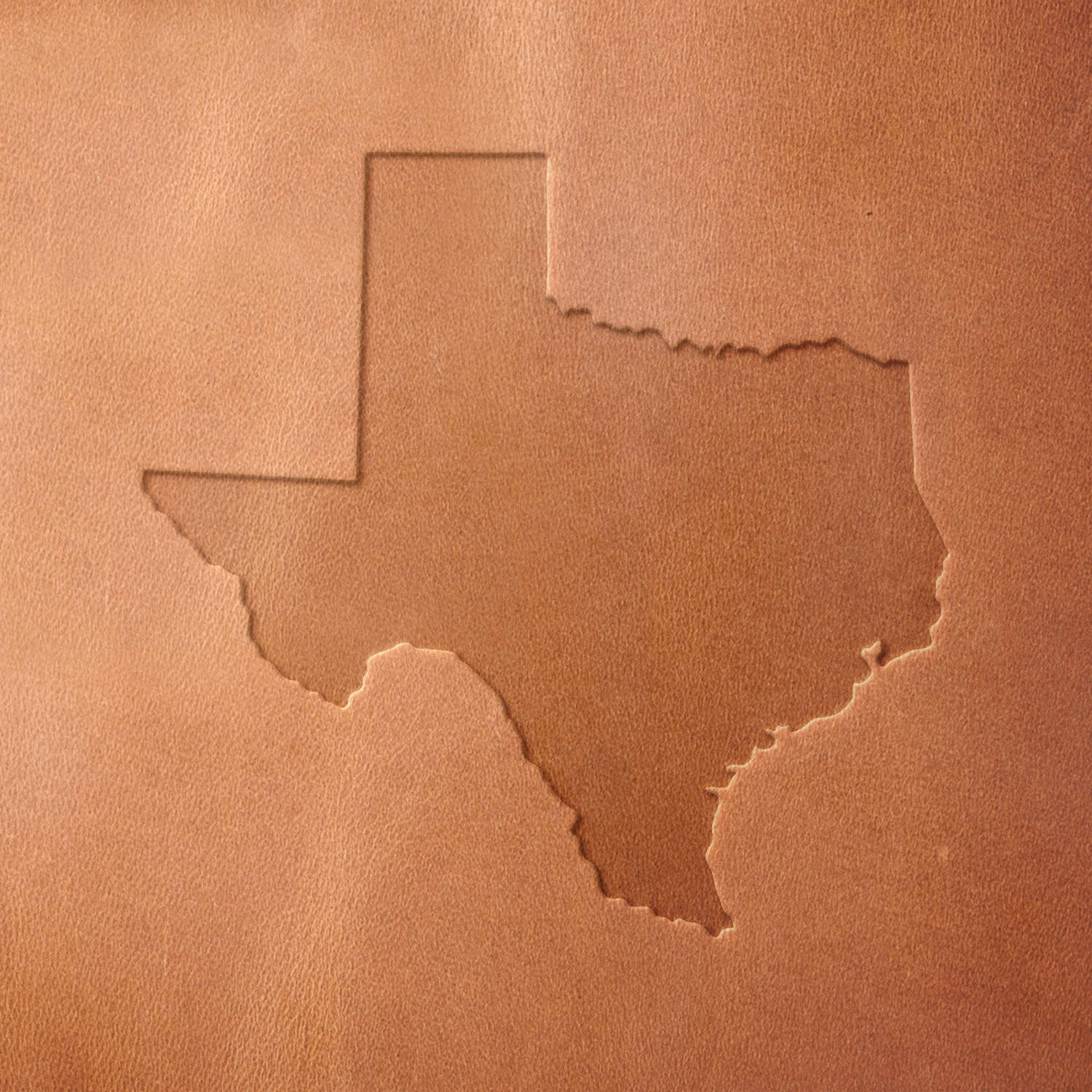 Leather sample with a crisp Texas state outline stamp impression, perfect for customizing Western and Texas-inspired leather designs.