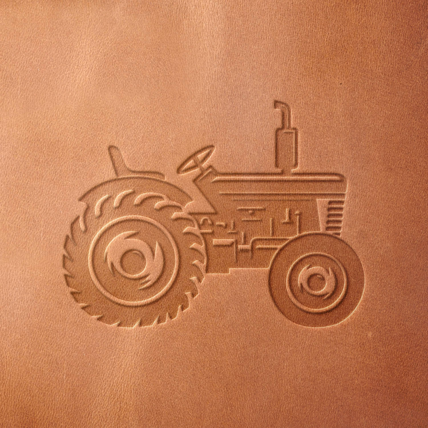 Leather sample with a crisp tractor stamp impression from a Delrin leather stamp, ideal for creating high-quality farm-themed leathercraft projects.