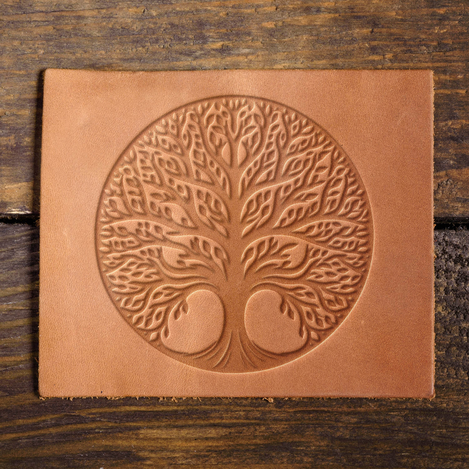 Leather sample with a stamped tree of life impression, adding a meaningful and organic touch to leather projects.