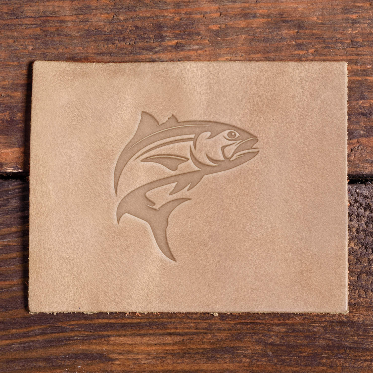 Leather sample with a stamped fish design using a Delrin leather stamp, ideal for fishing or outdoor-themed leather projects.