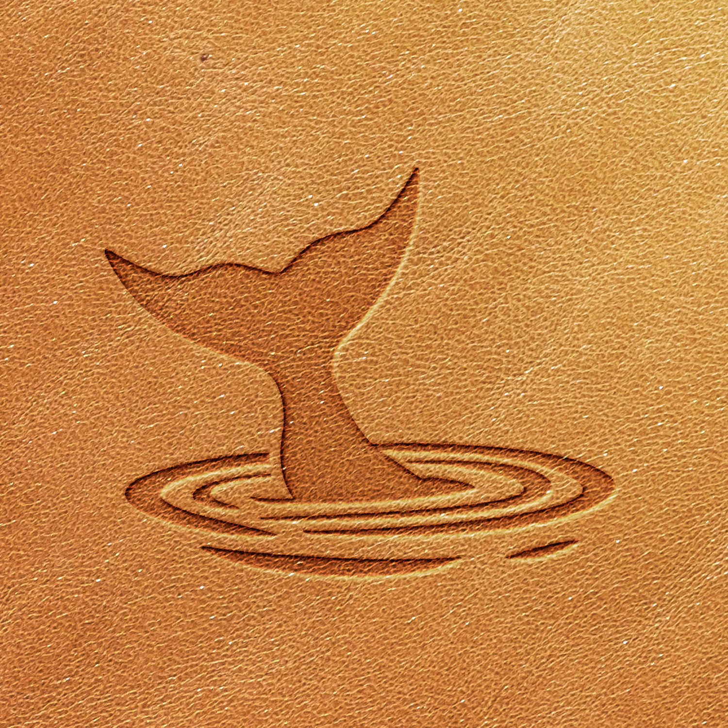 A brown leather texture featuring the embossed design of the "Whale Tail in Water Delrin Leather Stamp," showcasing a whale tail emerging from water with concentric ripple patterns surrounding it.