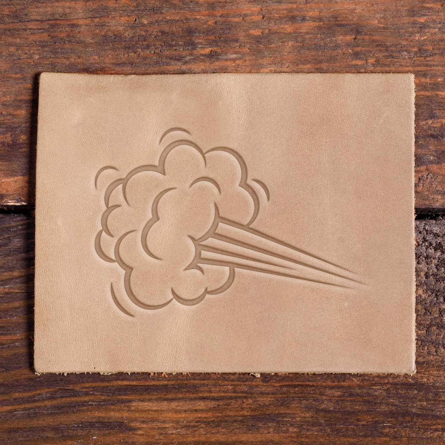 Dynamic wind burst design cleanly stamped into leather using a Delrin leather stamp.