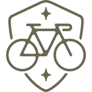 Modern bicycle emblem design featuring a sleek road bike within a shield frame, accented with decorative star details.
