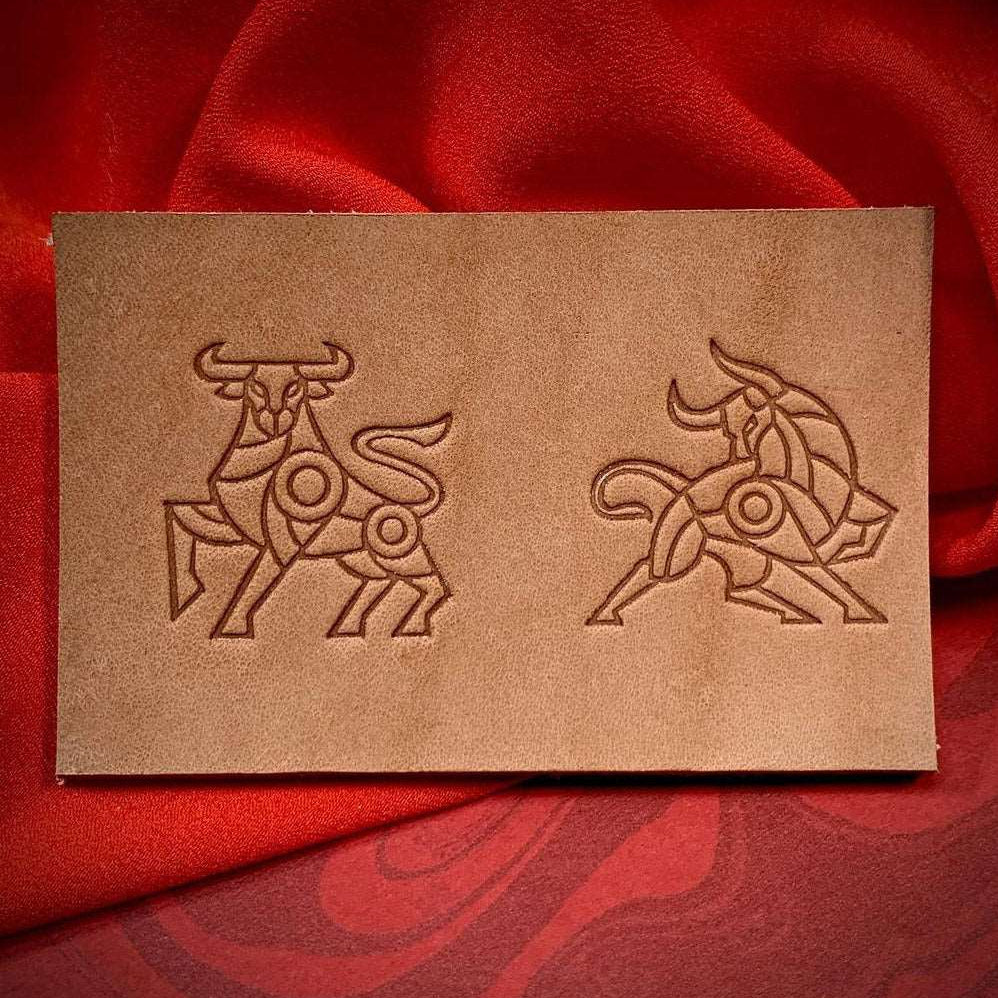 Stamped impression of a geometric bull made with a Delrin leather stamp on natural veg-tan leather.