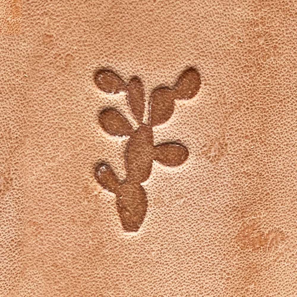 Natural veg-tan leather stamped with a prickly pear cactus silhouette using a Delrin leather stamp, showing bold pad shapes and clean edges.