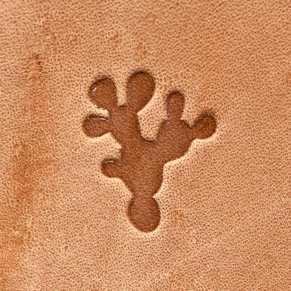 Natural veg-tan leather stamped with a prickly pear cactus silhouette using a Delrin leather stamp, showing bold pad shapes and clean edges.