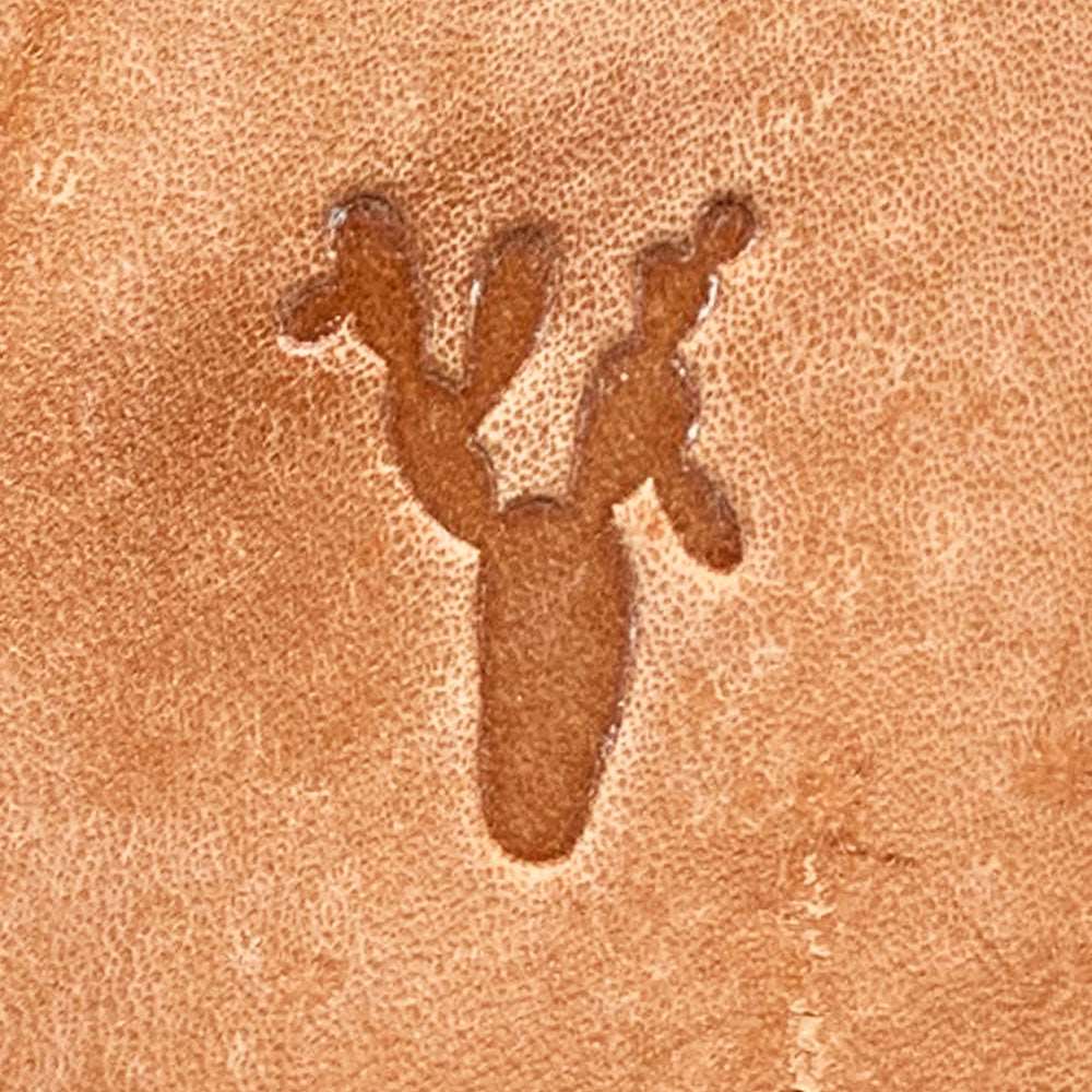 Natural veg-tan leather stamped with a prickly pear cactus silhouette using a Delrin leather stamp, showing bold pad shapes and clean edges.