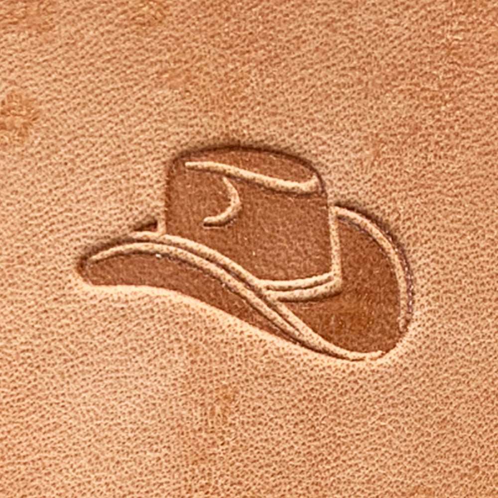Stamped impression of a classic cowboy hat made with a Delrin leather stamp on natural veg-tan leather.